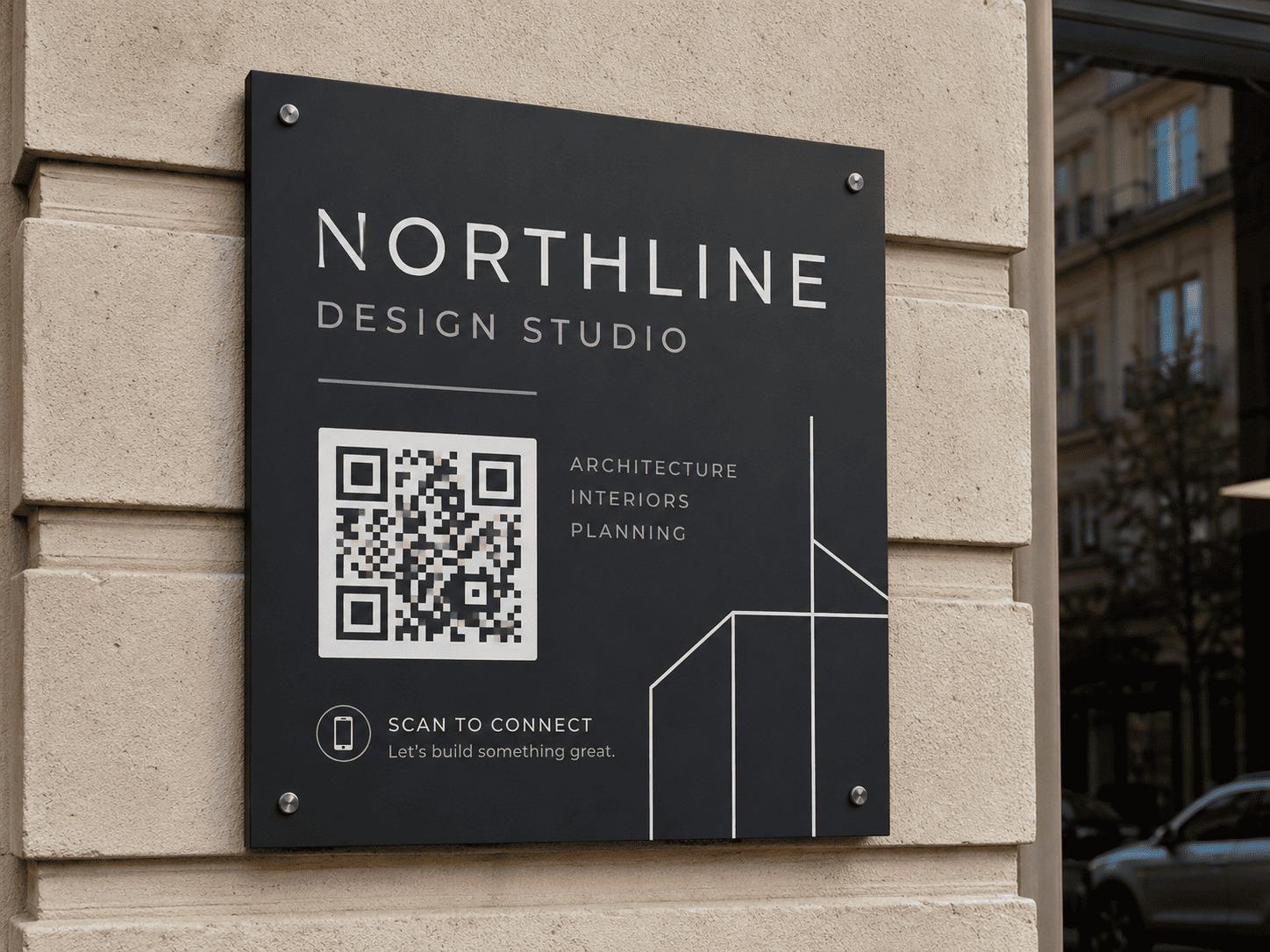 Wall-mounted studio plaque with a QR code linking to the studio's contact page